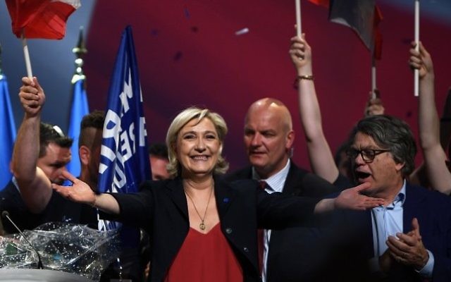 French presidential election candidate for the far-right Front National (FN) party Marine Le Pen reacts at the end of a campaign meeting on April 19, 2017, in Marseille, southern France. (AFP PHOTO / ANNE-CHRISTINE POUJOULAT) French presidential election candidate for the far-right Front National (FN) party Marine Le Pen reacts at the end of a campaign meeting on April 19, 2017, in Marseille, southern France. (AFP PHOTO / ANNE-CHRISTINE POUJOULAT)