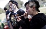 An Israeli smokes a marijuana joint in Jerusalem on April 20, 2017 during a rally at the Rose garden, to celebrate 420 and to express their defiance of current laws. (AFP PHOTO / THOMAS COEX)