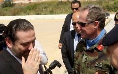 Lebanese Prime Minister Saad Hariri, left, gestures next to the Head of Mission and Force Commander of the United Nations Interim Force in Lebanon (UNIFIL), Major General Michael Beary, center, of Ireland, during a visit to the UNIFIL headquarters in the southern Lebanese village of Naqura on April 21, 2017.  (AFP/ Mahmoud ZAYYAT)
