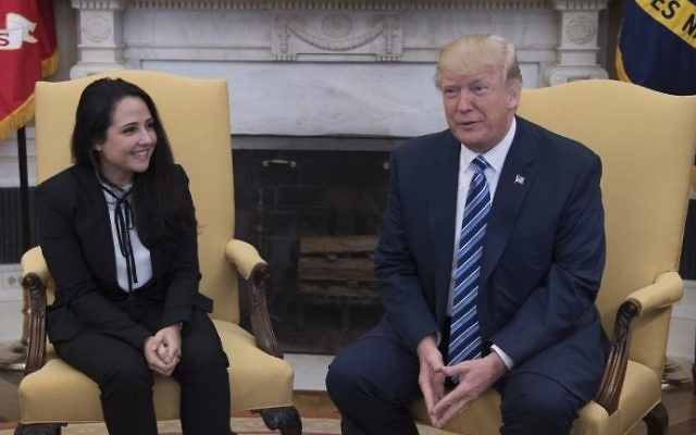 US President Donald Trump (R) shakes hands with Aya Hijazi, an Egyptian-American aid worker at the White House in Washington, DC, April 21, 2017.
Hijazi was flown back to the US April 20 following three years of captivity in Egypt. (AFP Photo/Jim Watson) US President Donald Trump (R) shakes hands with Aya Hijazi, an Egyptian-American aid worker at the White House in Washington, DC, April 21, 2017.
Hijazi was flown back to the US April 20 following three years of captivity in Egypt. (AFP Photo/Jim Watson)