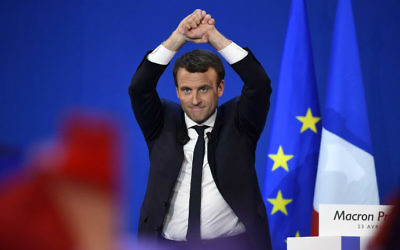 French presidential election candidate for the En Marche ! movement Emmanuel Macron celebrates at the Parc des Expositions in Paris, on April 23, 2017, after the first round of the Presidential election. (Eric FEFERBERG / AFP)