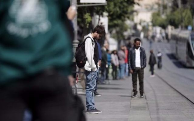 People stand in silence on Jerusalem's Jaffa Road on April 24, 2017, as sirens wail across Israel for two minutes marking the annual day of remembrance for the six million Jewish victims of the Holocaust. (Thomas Coex/AFP) People stand in silence on Jerusalem's Jaffa Road on April 24, 2017, as sirens wail across Israel for two minutes marking the annual day of remembrance for the six million Jewish victims of the Holocaust. (Thomas Coex/AFP)