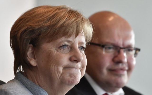 German Chancellor Angela Merkel (L) and German Chief of Staff Peter Altmaier attend the weekly Cabinet Meeting in Berlin, on April 26, 2017. / AFP PHOTO / John MACDOUGALL German Chancellor Angela Merkel (L) and German Chief of Staff Peter Altmaier attend the weekly Cabinet Meeting in Berlin, on April 26, 2017. / AFP PHOTO / John MACDOUGALL