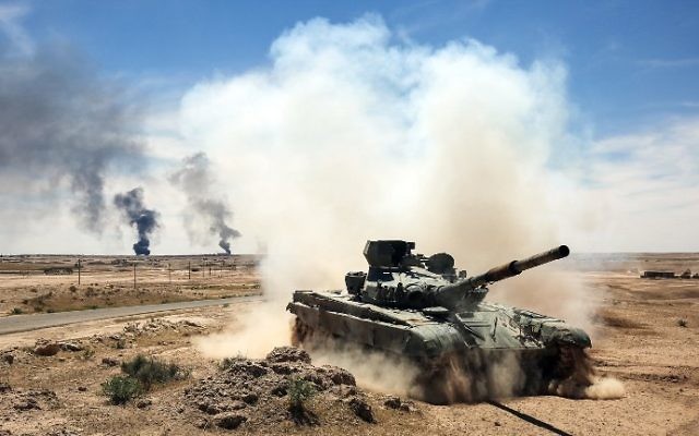 An Iraqi-modified T-72M tank belonging to the pro-government Hashed al-Shaabi paramilitary forces advances towards the UNESCO-listed ancient city of Hatra, southwest of the northern city of Mosul, during an offensive to retake the area from Islamic State (IS) group fighters, on April 26, 2017. (AFP Photo/Ahmad Al-Rubaye) An Iraqi-modified T-72M tank belonging to the pro-government Hashed al-Shaabi paramilitary forces advances towards the UNESCO-listed ancient city of Hatra, southwest of the northern city of Mosul, during an offensive to retake the area from Islamic State (IS) group fighters, on April 26, 2017. (AFP Photo/Ahmad Al-Rubaye)