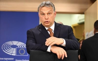 Hungary's Prime Minister Viktor Orban arrives at a press conference after attending a European Parliament plenum session on the situation in Hungary, on April 26, 2017 in Brussels. (AFP Photo/Emmanuel Dunand)