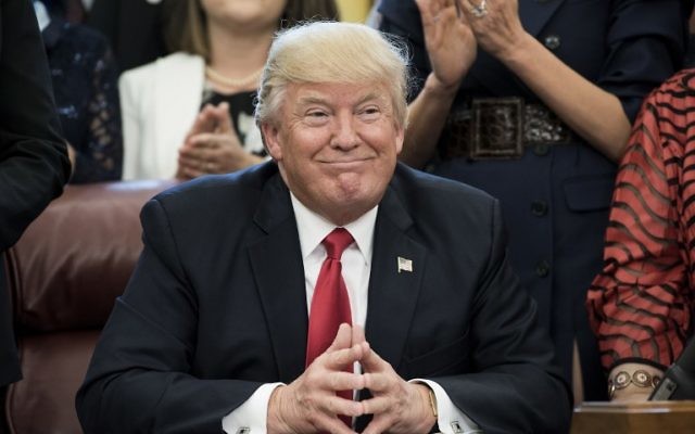 US President Donald Trump smiles during a national teacher of the year event in the Oval Office of the White House April 26, 2017 in Washington, DC. (AFP PHOTO / Brendan Smialowski)
