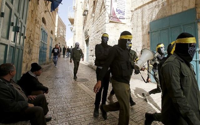 Shop owners sit outside their closed shops as Fatah movement supporters roam the streets of the West bank town of Bethlehem to control the general strike in support of Palestinian prisoners on hunger strike in Israeli jails on April 27, 2017. (Musa al-Shaer/AFP) Shop owners sit outside their closed shops as Fatah movement supporters roam the streets of the West bank town of Bethlehem to control the general strike in support of Palestinian prisoners on hunger strike in Israeli jails on April 27, 2017. (Musa al-Shaer/AFP)