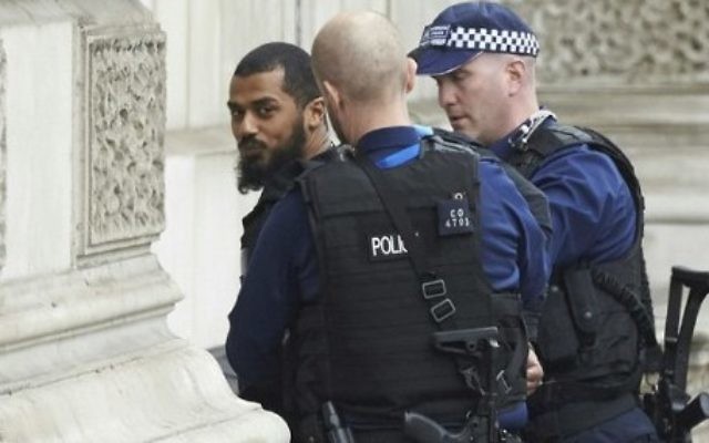 Firearms officiers from the British police detain Khalid Mohamed Omar Ali on Whitehall near the Houses of Parliament in central London on April 27, 2017 before being taken away by police. (AFP/Niklas Halle'n) Firearms officiers from the British police detain Khalid Mohamed Omar Ali on Whitehall near the Houses of Parliament in central London on April 27, 2017 before being taken away by police. (AFP/Niklas Halle'n)