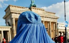 A woman wearing a burka during a demonstration against the German Bundeswehr army's deployment in Afghanistan in front of the Brandenburg Gate in Berlin on February 20, 2010. (AFP/David  Gannon)