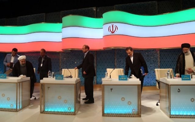 Iranian presidential candidates, left to right, Hassan Rouhani, Mohammad Baqer Qalibaf, Eshaq Jahangiri and Ebrahim Raisi attend a live debate on state TV in Tehran on April 28, 2017. (AFP/Jamejamonline/Mehdi Dehghan) Iranian presidential candidates, left to right, Hassan Rouhani, Mohammad Baqer Qalibaf, Eshaq Jahangiri and Ebrahim Raisi attend a live debate on state TV in Tehran on April 28, 2017. (AFP/Jamejamonline/Mehdi Dehghan)