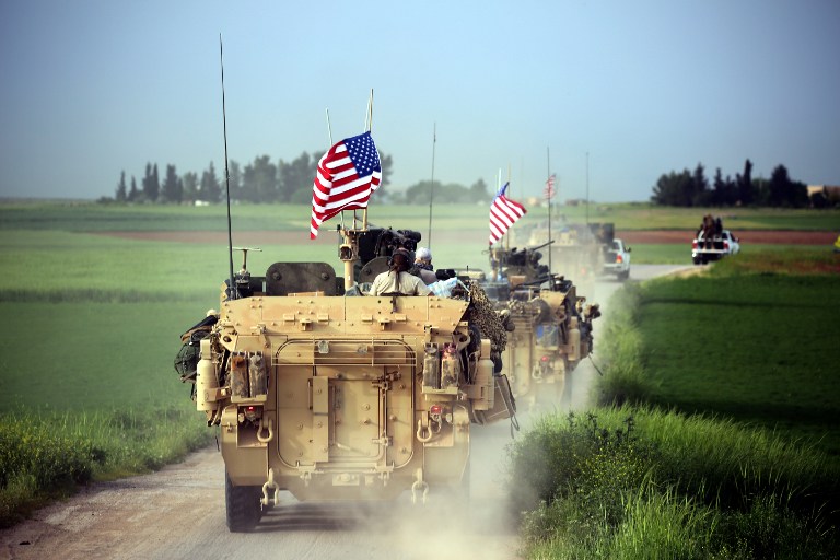 US forces, accompanied by Kurdish People's Protection Units (YPG) fighters, drive their armored vehicles near the northern Syrian village of Darbasiya on April 28, 2017. (AFP/Delil Souleiman) US forces, accompanied by Kurdish People's Protection Units (YPG) fighters, drive their armored vehicles near the northern Syrian village of Darbasiya on April 28, 2017. (AFP/Delil Souleiman)