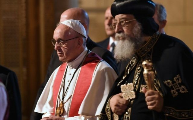 Pope Francis (L) walks alongside Coptic Pope Tawadros II (R) during a visit at the Saint Peter and Saint Paul church in Cairo, which was target by a suicide bomb attack that killed 29 people last December, on April 28, 2017. (AFP/Andreas Solaro) Pope Francis (L) walks alongside Coptic Pope Tawadros II (R) during a visit at the Saint Peter and Saint Paul church in Cairo, which was target by a suicide bomb attack that killed 29 people last December, on April 28, 2017. (AFP/Andreas Solaro)