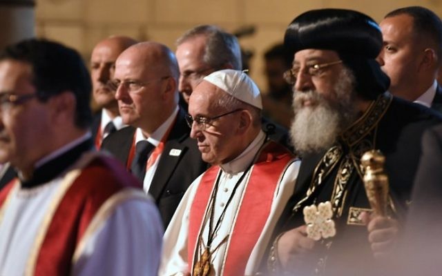 Pope Francis (C) walks alongside Coptic Pope Tawadros II (R) during a visit at the Saint Peter and Saint Paul church in Cairo, which was target by a suicide bomb attack that killed 29 people last December, on April 28, 2017.
(Andreas Solaro/AFP) Pope Francis (C) walks alongside Coptic Pope Tawadros II (R) during a visit at the Saint Peter and Saint Paul church in Cairo, which was target by a suicide bomb attack that killed 29 people last December, on April 28, 2017.
(Andreas Solaro/AFP)