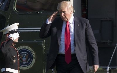 US President Donald Trump walks after arriving on Marine One on the South Lawn of the White House in Washington, DC, April 28, 2017, following a trip to Atlanta, Georgia. (AFP PHOTO / SAUL LOEB)