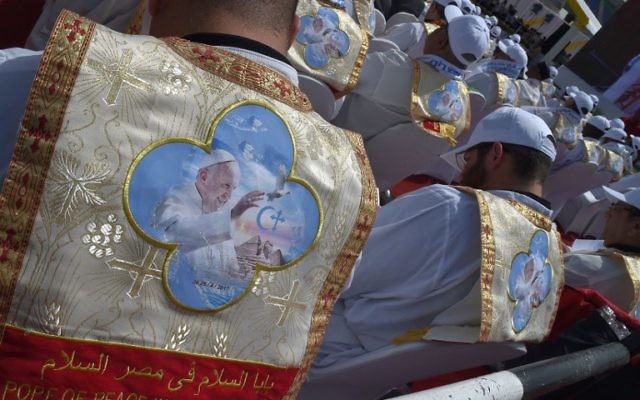 Egyptian worshippers wear clothing celebrating the visit of Pope Francis to their country during a mass by the pontiff on April 29, 2017 at a stadium in Cairo. (AFP PHOTO / Andreas SOLARO)