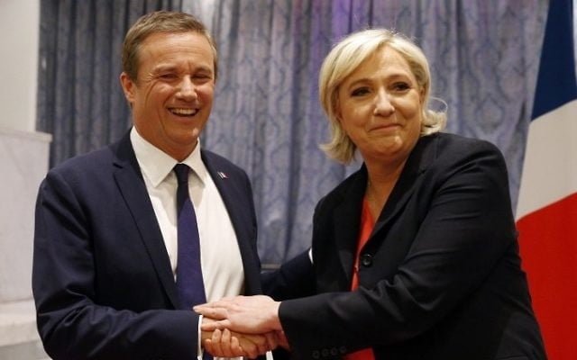 Former French presidential election candidate for the right-wing Debout la France (DLF) party Nicolas Dupont-Aignan (L) and French presidential election candidate for the far-right Front National (FN) party Marine Le Pen, shake hands at the end of a joint statement at FN headquarters in Paris, on April 29, 2017. (AFP/Geoffroy van der Hasselt) Former French presidential election candidate for the right-wing Debout la France (DLF) party Nicolas Dupont-Aignan (L) and French presidential election candidate for the far-right Front National (FN) party Marine Le Pen, shake hands at the end of a joint statement at FN headquarters in Paris, on April 29, 2017. (AFP/Geoffroy van der Hasselt)