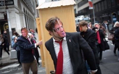 Participants wear President Trump masks as part of an event entitled 'New York City's 32nd Annual April Fools' Day Parade: It's a Trumpathon!' on April 1, 2017 in New York City (Kevin Hagen/Getty Images/AFP)