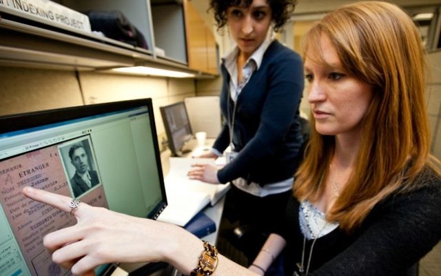 Scholars use digitized ITS materials at USHMM. (Courtesy USHMM)