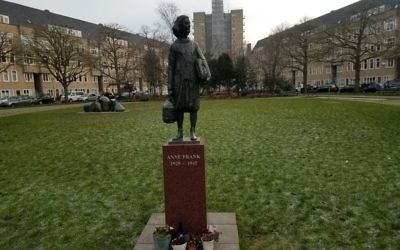 Erected in 2005, a statue of Anne Frank stands close to the Frank family's former apartment in Amsterdam's River Quarter, January 2017. (Matt Lebovic/The Times of Israel)