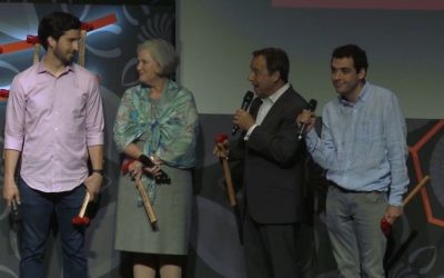 The Suskind family accepting their prize at the Tribeca Disruptive Innovation Awards. From left, Walter, Cornelia, Ron and Owen. (Vimeo/screenshot)
