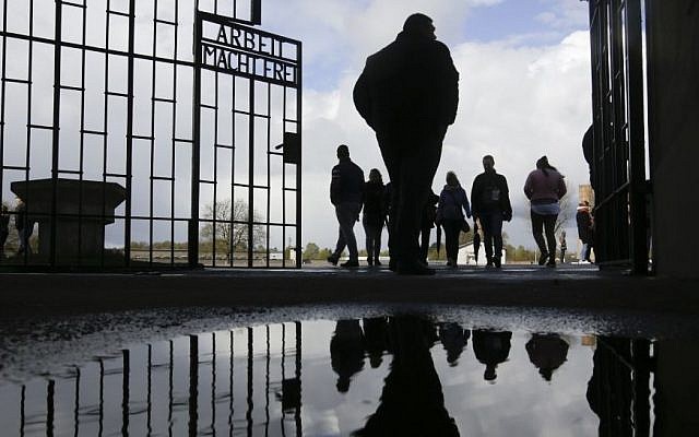 People enter the Sachsenhausen Nazi death camp through the gate with the inscription 'Arbeit macht frei' (work sets you free) for commemorations for the 72nd anniversary of the liberation of the camp in Oranienburg, about 35 kilometer north of Berlin, April 23, 2017. (AP/Markus Schreiber) People enter the Sachsenhausen Nazi death camp through the gate with the inscription 'Arbeit macht frei' (work sets you free) for commemorations for the 72nd anniversary of the liberation of the camp in Oranienburg, about 35 kilometer north of Berlin, April 23, 2017. (AP/Markus Schreiber)