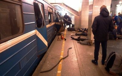 Blast victims lie near a subway train hit by a explosion at the Tekhnologichesky Institut subway station in St. Petersburg, Russia, Monday, April 3, 2017. (AP/DTP&ChP St. Peterburg via AP)