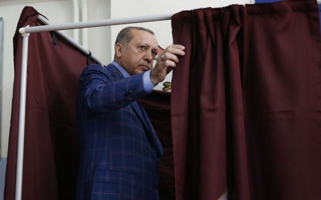 Turkey's President Recep Tayyip Erdogan enters a voting booth inside a polling station in Istanbul, Turkey, on Sunday, April 16, 2017. (AP/Lefteris Pitarakis) Turkey's President Recep Tayyip Erdogan enters a voting booth inside a polling station in Istanbul, Turkey, on Sunday, April 16, 2017. (AP/Lefteris Pitarakis)