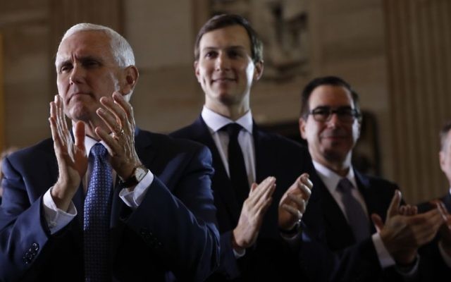 From left, US Vice President Mike Pence, White House senior adviser Jared Kushner and Treasury Secretary Steve Mnuchin applaud on Capitol Hill in Washington, Tuesday, April 25, 2017, where US President Donald Trump spoke at the United States Holocaust Memorial Museum's National Days of Remembrance ceremony. (AP Photo/Pablo Martinez Monsivais)
