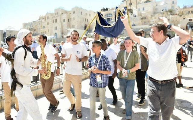 Some of the orphaned bar mitzvah boys being danced to the Western Wall for the Colel Chabad celebration (Courtesy Israel Bardugo) Some of the orphaned bar mitzvah boys being danced to the Western Wall for the Colel Chabad celebration (Courtesy Israel Bardugo)