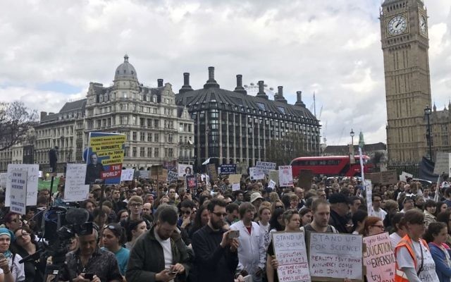 Scientists protest in Parliament Square, central London, during the March for Science, Saturday, April 22, 2017. Thousands of scientists worldwide made plans to leave their labs and take to the streets Saturday to rail against what they say are mounting attacks against science. (Jack Hardy/PA via AP)