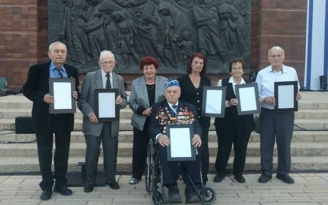 From left: Moshe Jakubowitz, Moshe Ha-Elion, Esther Miron, Max Privler, Jeannine Stephane-Bouhanna, Elka Abromovitz, and Moshe Porat, the torch lighters for the 2017 Holocaust Remembrance Day ceremony at Yad Vashem in Jerusalem (Yaakov Schwartz/Times of Israel)