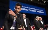 The Daily Show correspondent Hasan Minhaj stands at the head table during the White House Correspondents' Dinner in Washington, April 29, 2017. (AP Photo/Cliff Owen)
