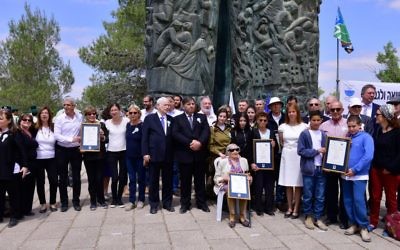 Danny Atar, KKL/JNF World Chairman (center), and Dr. Haim V. Katz, Chairman of the B’nai B’rith World Center along the Jewish rescuers and their families at the B’nai B’rith Martyr’s Forest 'Scroll of Fire' Plaza on April 24, 2017. (Rafi Ben Hakoon) Danny Atar, KKL/JNF World Chairman (center), and Dr. Haim V. Katz, Chairman of the B’nai B’rith World Center along the Jewish rescuers and their families at the B’nai B’rith Martyr’s Forest 'Scroll of Fire' Plaza on April 24, 2017. (Rafi Ben Hakoon)