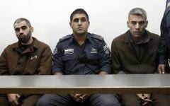 Ayad Fatafta and Kifah Ghanimat, convicted of murdering Kristine Luken and injuring Kay Wilson in a stabbing attack in the Jerusalem Forest on December 18, 2010, seen at the Jerusalem District Court on November 24, 2011. (Uri Lenz/Flash90)