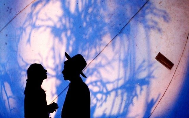 A couple stands next to a large light installation in the Old City of Jerusalem, June 6, 2013. (Sliman Khader/Flash90)