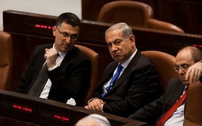 Prime Minister Benjamin Netanyahu (C) and then interior minister Gideon Sa'ar (L) seen at the Knesset on July 9, 2013. (Flash 90)
