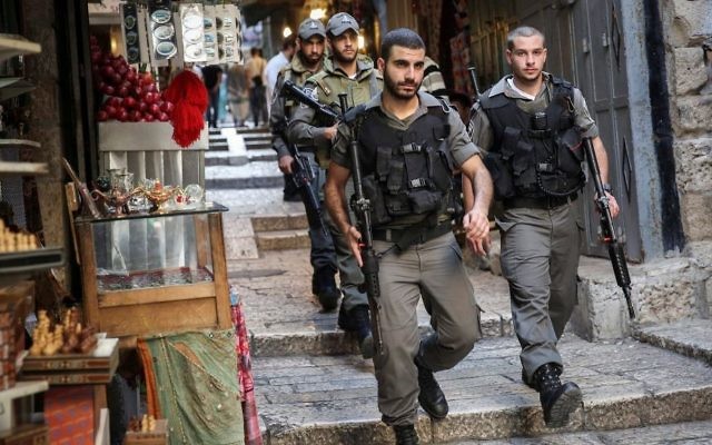Illustrative: Border Police walk through Jerusalem's Old City on October 11, 2015. (Hadas Parush/Flash90) Illustrative: Border Police walk through Jerusalem's Old City on October 11, 2015. (Hadas Parush/Flash90)
