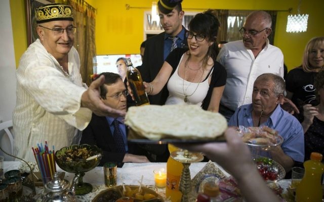 A 2016 Mimouna celebration attended by Knesset member Isaac Herzog (second from left) in Beit Shemesh (Hadas Parush/Flash 90) A 2016 Mimouna celebration attended by Knesset member Isaac Herzog (second from left) in Beit Shemesh (Hadas Parush/Flash 90)