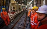 Chinese workers attend the opening ceremony of the construction works for the new Tel Aviv Light Rail on February 19, 2017. (Flash90)