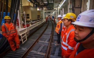 Chinese workers attend the opening ceremony of the construction works for the new Tel Aviv Light Rail on February 19, 2017. (Flash90)