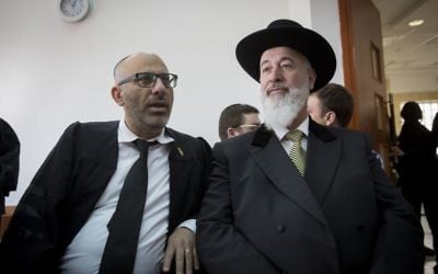 Former Chief Rabbi of Israel, Yona Metzger (r) seen at the Jerusalem District Court during his trial, suspected of taking bribe, fraud, and involvement in criminal activities, on February 23, 2017. (Miriam Alster/Flash90)