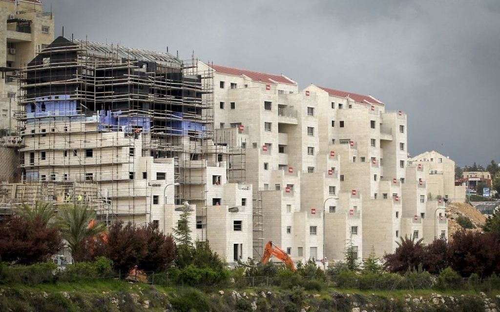 Construction in the Israeli settlement of Kiryat Arba, near the West Bank city of Hebron, on April 2, 2017. (Wisam Hashlamoun/Flash90) Construction in the Israeli settlement of Kiryat Arba, near the West Bank city of Hebron, on April 2, 2017. (Wisam Hashlamoun/Flash90)