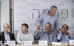 Mayor of Acre Shimon Lankri, Former IDF chief of staff Gabi Ashkenazi (2L), Shlomo Dovrat, former IDF Chief of staff Benny Gantz (standing) and former education minister Shai Piron at a press conference for the new social movement "Pnima", in Lod, on April 03, 2017. (Tomer Neuberg/FLASH90)