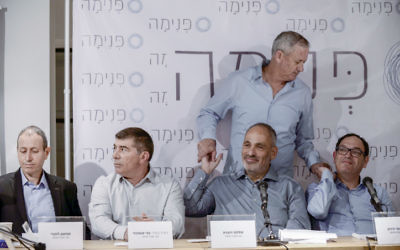 Mayor of Acre Shimon Lankri, Former IDF chief of staff Gabi Ashkenazi (2L), Shlomo Dovrat, former IDF Chief of staff Benny Gantz (standing) and former education minister Shai Piron at a press conference for the new social movement "Pnima", in Lod, on April 03, 2017. (Tomer Neuberg/FLASH90)