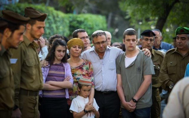 The family of slain soldier Sgt. Elchai Taharlev at Mt Herzl, in Jerusalem on April 06, 2017. (FLASH90) The family of slain soldier Sgt. Elchai Taharlev at Mt Herzl, in Jerusalem on April 06, 2017. (FLASH90)