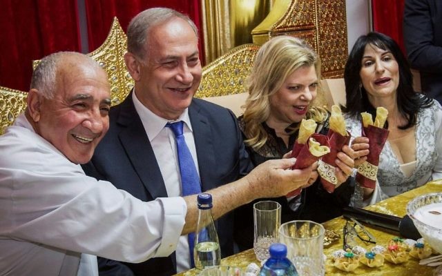 Prime Minister Benjamin Netanyau and his wife Sara attend a Mimouna celebration in Hadera on April 17, 2017. (Ido Erez/Pool/Flash90) Prime Minister Benjamin Netanyau and his wife Sara attend a Mimouna celebration in Hadera on April 17, 2017. (Ido Erez/Pool/Flash90)