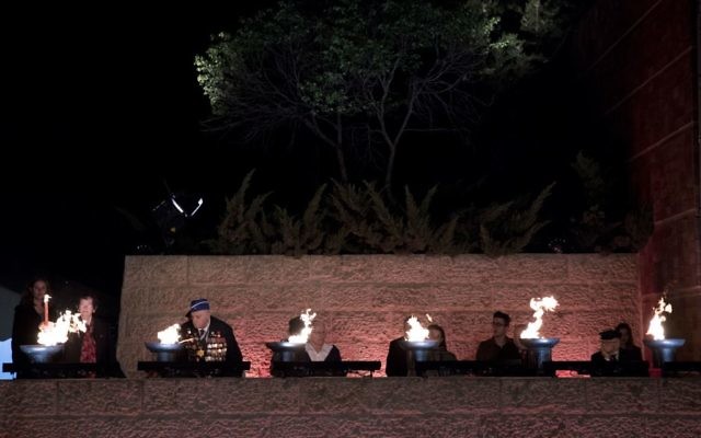 Holocaust survivors light six torches representing the six million victims of the Nazi genocide during the opening ceremony at the Yad Vashem Holocaust Memorial Museum in Jerusalem, April 23, 2017. (Yonatan Sindel/Flash90) Holocaust survivors light six torches representing the six million victims of the Nazi genocide during the opening ceremony at the Yad Vashem Holocaust Memorial Museum in Jerusalem, April 23, 2017. (Yonatan Sindel/Flash90)