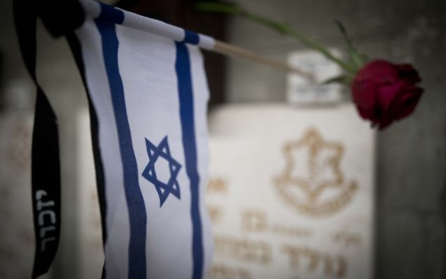 Ahead of Memorial Day events, flags lay on graves of fallen Israeli soldiers on Mount Herzl Military Cemetery in Jerusalem, April 28, 2017. (Yonatan Sindel/Flash90) Ahead of Memorial Day events, flags lay on graves of fallen Israeli soldiers on Mount Herzl Military Cemetery in Jerusalem, April 28, 2017. (Yonatan Sindel/Flash90)