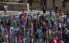 Children play in the fountains at Teddy Kollek Park in Jerusalem  on July 26, 2016 (Zack Wajsgras/Flash90)
