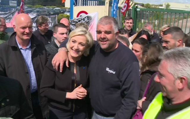 Far-right French presidential candidate Marine Le Pen is greeted by workers outside a Whirlpool home appliance factory in Amiens, France, Wednesday April 26, 2017. (AP Photo) Far-right French presidential candidate Marine Le Pen is greeted by workers outside a Whirlpool home appliance factory in Amiens, France, Wednesday April 26, 2017. (AP Photo)